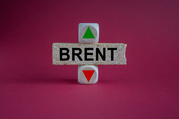 Brent symbol. A wooden cubes with up arrow. Brick block with the concept word BRENT . Beautiful red...