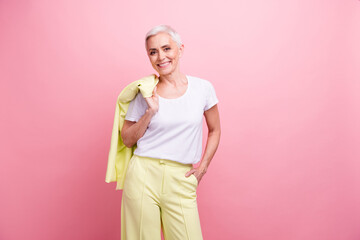 Portrait of successful business lady on pensioner holding yellow blazer expert specialist in...