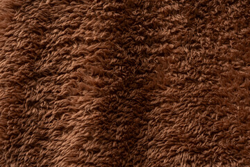 Texture of a brown faux fur as a background.