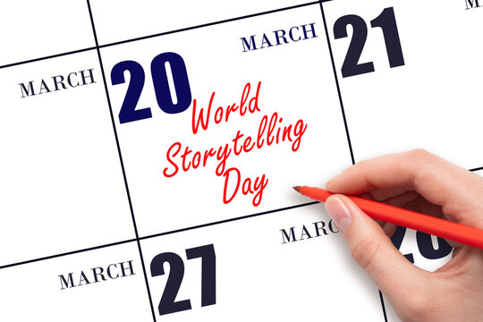 March 20. Hand writing text World Storytelling Day on calendar date. Save the date.