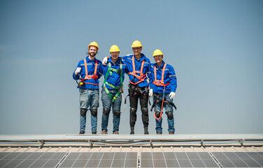 Team of technicians working on the roof eco solar farm Renewable clean energy technology concept...