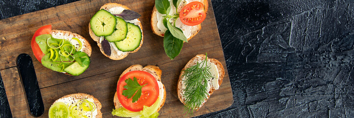 banner of six vegetable sandwiches with cream cheese, tomatoes, dill, cucumbers, leeks and basil....