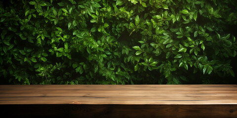 Empty wooden table against a background of plants. Concept template for presentation of products, cosmetics, drinks, etc. Copyspace layout
