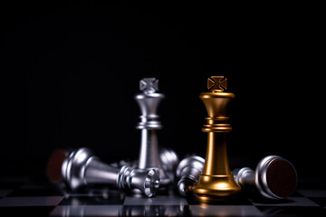 Golden and Silver King chess is last standing in the chess board, Concept of successful business leadership, Confrontation and loss