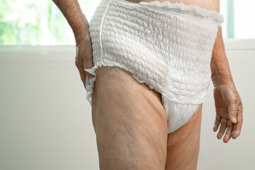 Asian senior woman patient wearing incontinence diaper in hospital, healthy strong medical concept.
