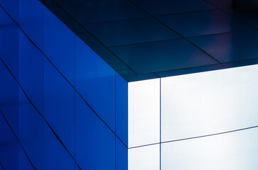 fragment of the wall of a modern blue building on a white background