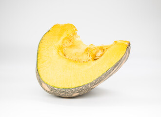 Sliced pumpkin chunks isolated on white background