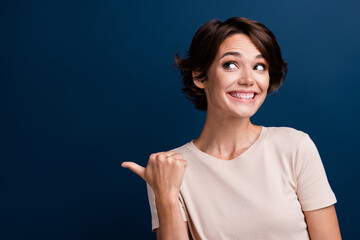 Portrait of tricky face lady promoter directing finger empty space presenting big sale offer...