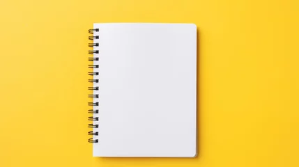 Foto op Plexiglas Vibrant yellow background with open notebook - copy space for text, minimalistic office or school concept © Ashi