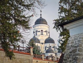 Fototapeta na wymiar Capriana Monastery outdoors winter view. Traditional Christian Orthodox church located in Republic of Moldova. Eastern Europe basilica traditional architecture style