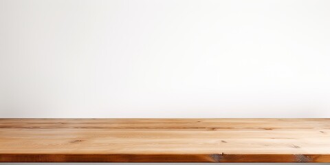 Fototapeta premium Wooden tabletop against white backdrop.