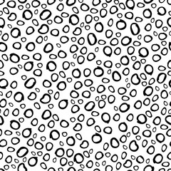 Organic hand-drawn circles vector seamless pattern. Irregular pebble shaped elements collection in black over white. Creative art texture for printing on various surfaces or usage in graphic design.