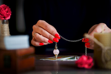 Blurred tarot cards on the table, esoteric concept, fortune telling predictions