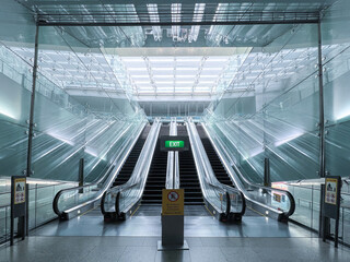 Airport Interior with Glass Escalator in an Empty Hallway