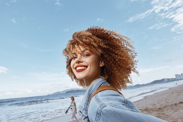 Smiling Woman enjoying Freedom and Nature on a Beach Vacation