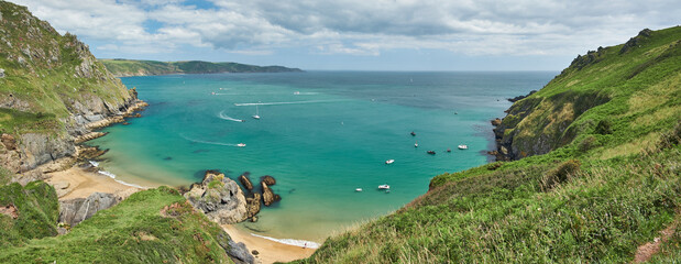 Panorama of boats in Starehole Bay near Salcombe seen from the South West Coast Path, Devon, UK