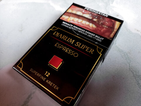Djarum Super espresso Kretek close up. Packaged cigarettes. Djarum Super espresso Kretek cigarettes on isolated background. Cirebon-Indonesia,1-02-2024