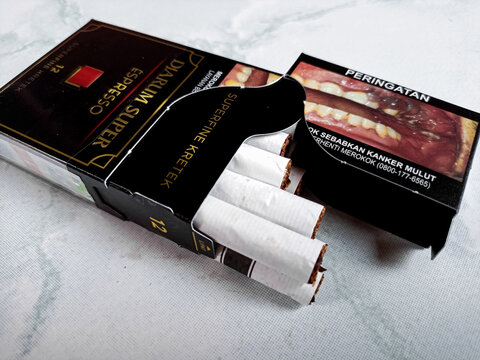 Djarum Super espresso Kretek close up. Packaged cigarettes. Djarum Super espresso Kretek cigarettes on isolated background. Cirebon-Indonesia,1-02-2024