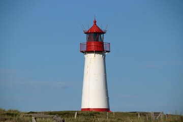Fototapeta na wymiar Red and White lighthouse in Sylt Germany