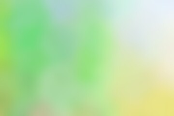 Abstract blurred background image of green, yellow colors gradient used as an illustration. Designing posters or advertisements.