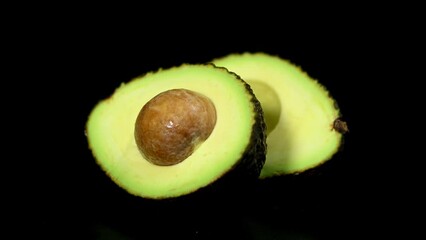 Avocado ripe vegetable seed on black background