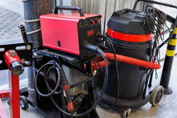 Inverter welding machine. Equipment for welding metals in an automobile workshop.