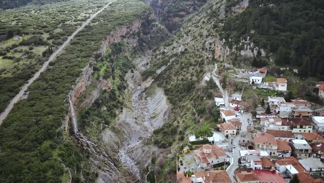 Aerial footage of Tithorea village overlooking Velista Gorge in Amfikleia-Elateia, Greece