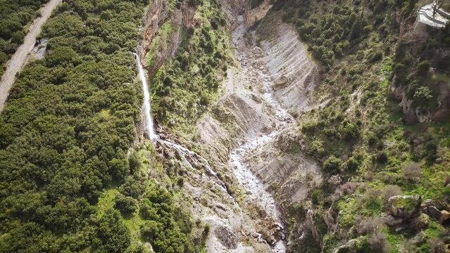 Ascending drone footage of the Upper Tithorea Falls and Velista Gorge in Tithorea village, Greece