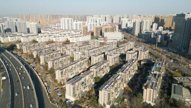 An aerial perspective reveals a residential neighborhood in Linyi, Shandong Province, China, exemplifying the principles of modernity, urbanization, and the swift expansion of urban areas.