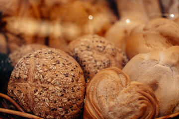 Fresh baked multigrain bread in a wicker basket in a baked goods store