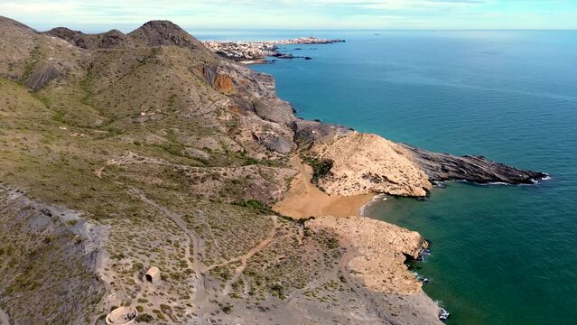 Calblanque coast aerial drone view point of coastline of mountains against mediterranean seascape in Cartagena coasts, Spain.