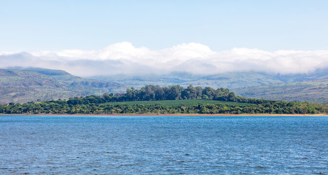 Lake Furnas during a beautiful sunny day, with a view of the Serra da Canastra in the background. Panoramic view of Lake Furnas, in the interior of Minas Gerais, Brazil.