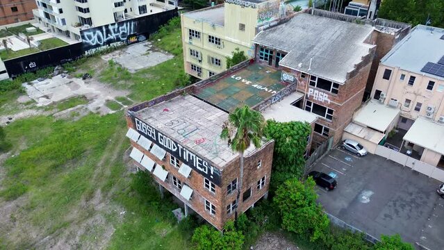 Drone aerial of abandoned derelict building haunted structure urban exploration block Gossy Good Times Gosford Central Coast Australia