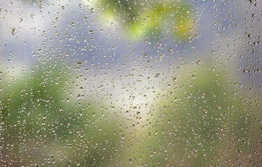 Raindrops on a Window Glass Full Frame Close Up Background