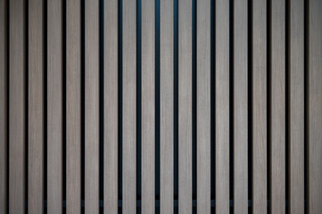 Pale Silver Scandinavian Wood Planks Mounted Vertically on a Black Wall Backdrop.