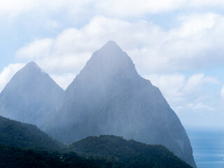 The Pitons are two mountainous volcanic plugs, volcanic spires, located in Saint Lucia. Petit Piton...