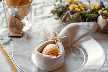 Happy Easter day. Easter card, background. Preparation for Easter. Serving, Flowers, toys. decorated table, handmade decorations for the holiday Easter. Eggs, hare