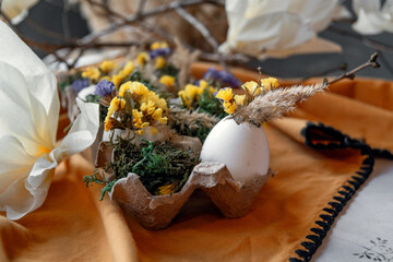 Happy Easter day. Easter card, background. Preparation for Easter. Serving, Flowers, toys. decorated table, handmade decorations for the holiday Easter. Eggs, hare
