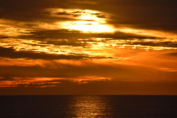 Vivid orange sunrise over the beach