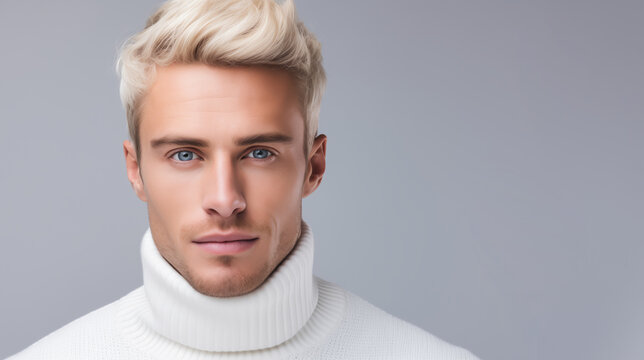 Handsome blond man with blue eyes with white turtleneck on white background