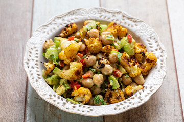 Vegan salad with chickpea, roast cauliflower and avocado