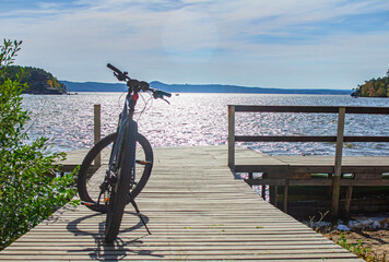 close-up details of a bicycle against a background of forest and lake, foreground and background...