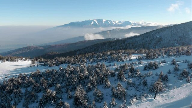 Drone snow covered Mountain Olympus Greece winter sunny day blue sky