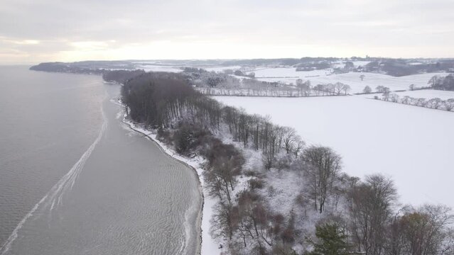 Shore of the Limfjord In Denmark Under The Snow - Aerial Drone Shot