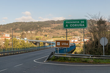 A Ponte Ulla, Spain. Road sign indicating directions to the Province of A Coruna and the river Ulla