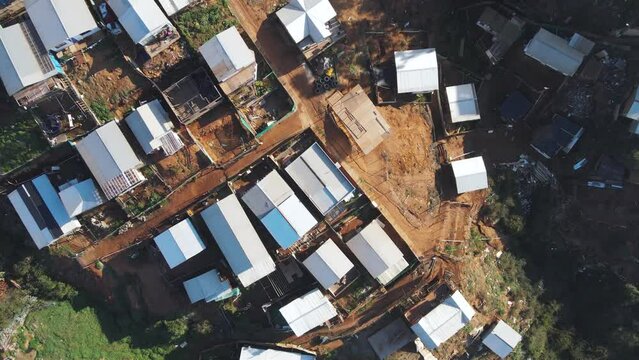 Top down drone shot flying over a less wealthy neighborhood of Valpara&iacute;so, Chile.