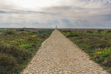 Ruins of the Fort of San Antonio de Beliche, walkway to the lighthouse at Cape St. Vincent. Sagres,...
