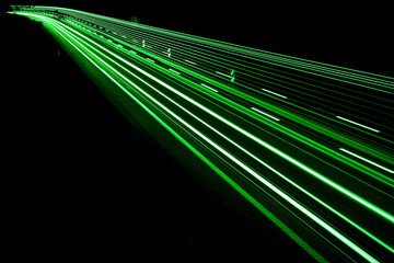 green car lights at night. long exposure