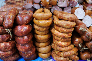 Sausage of different types on the counter in the store. Trade in meat products of good quality. Close-up.