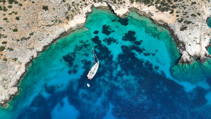 Aerial drone photo of sail boat anchored in paradise bay of Naousa with emerald crystal clear sea, Paros island, Cyclades, Greece